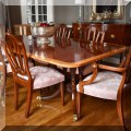 F20. Baker Furniture Historic Charleston banded double pedestal dining table with six chairs. 29&rdquo;h x 70&rdquo;wx 46&rdquo;d (includes 3 18&rdquo; leaves and custom pads) 